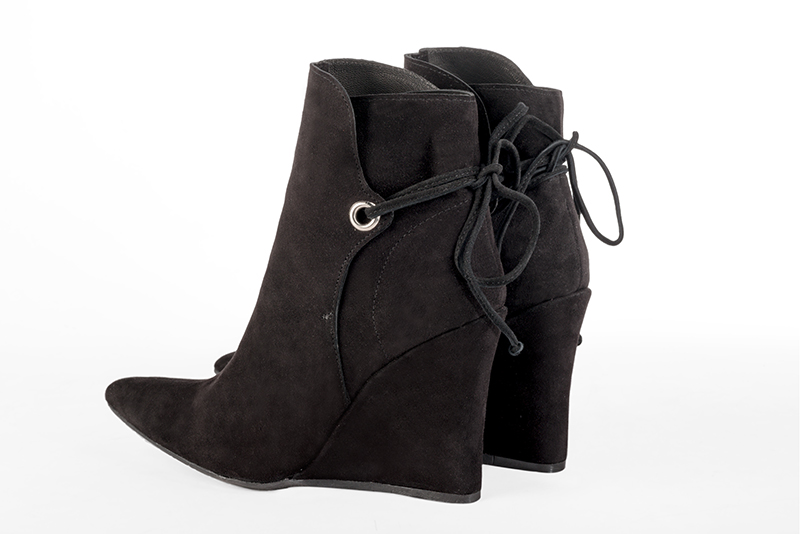 Matt black women's ankle boots with laces at the back. Tapered toe. Very high wedge heels. Rear view - Florence KOOIJMAN